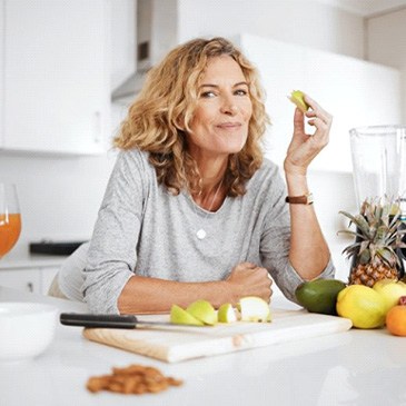 a woman enjoying healthier food options