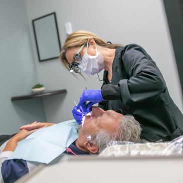 Dental hygienist giving a patient a preventive teeth cleaning in Allen